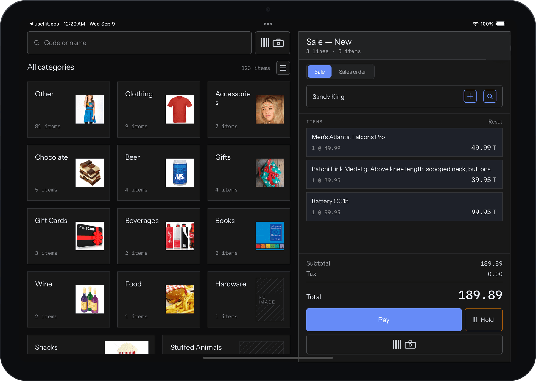 usellit.pos on an iPad in dark mode: a sale in progress with three items, the customer attached, the catalog grid beside it and a 189.89 total ready to pay